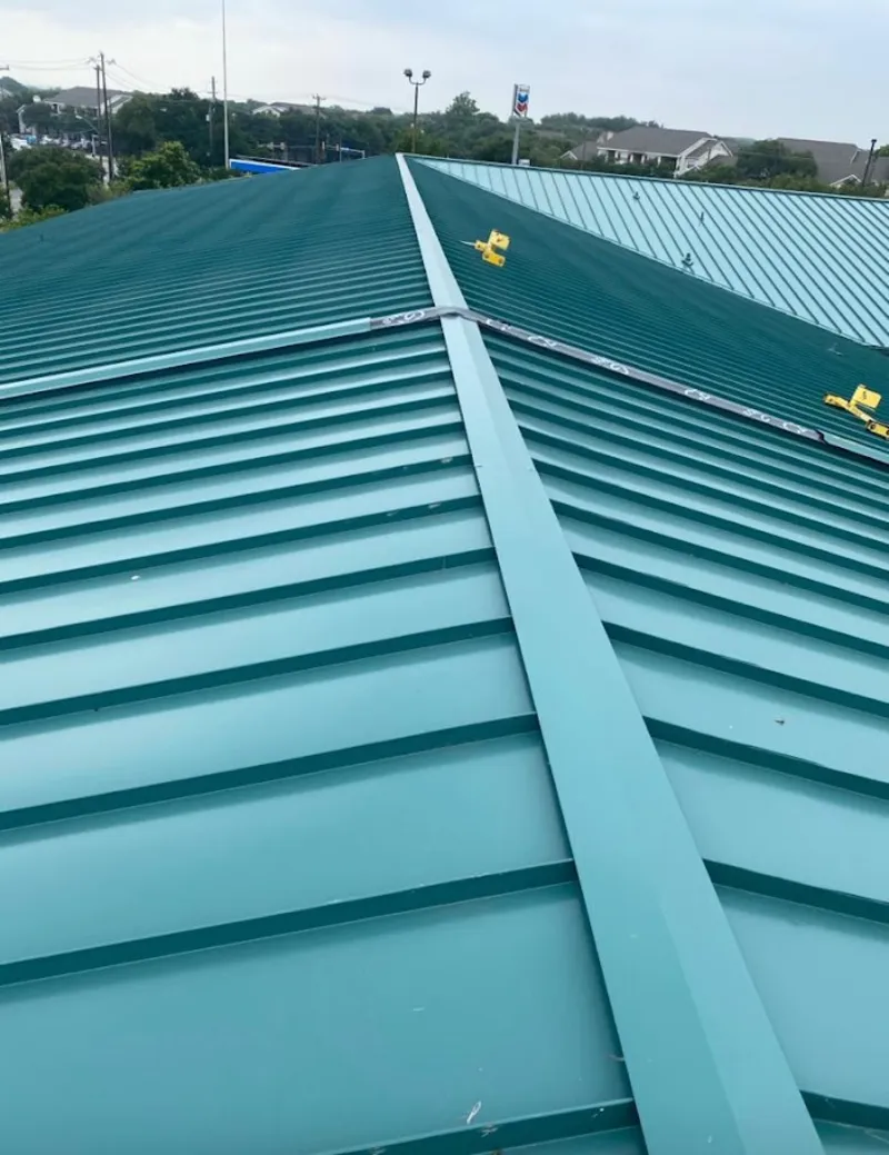 Green commercial metal roof ridge and valley for Metal Roof Repair in Branson