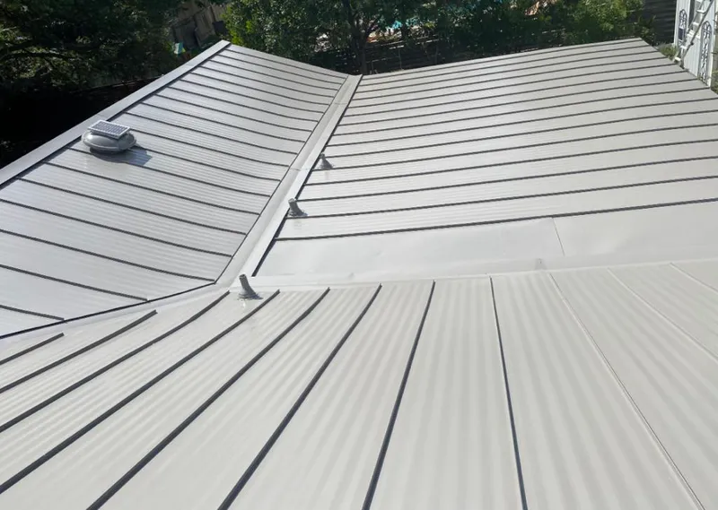 Solar attic fan installed on a metal roof for Roof Ventilation in Branson